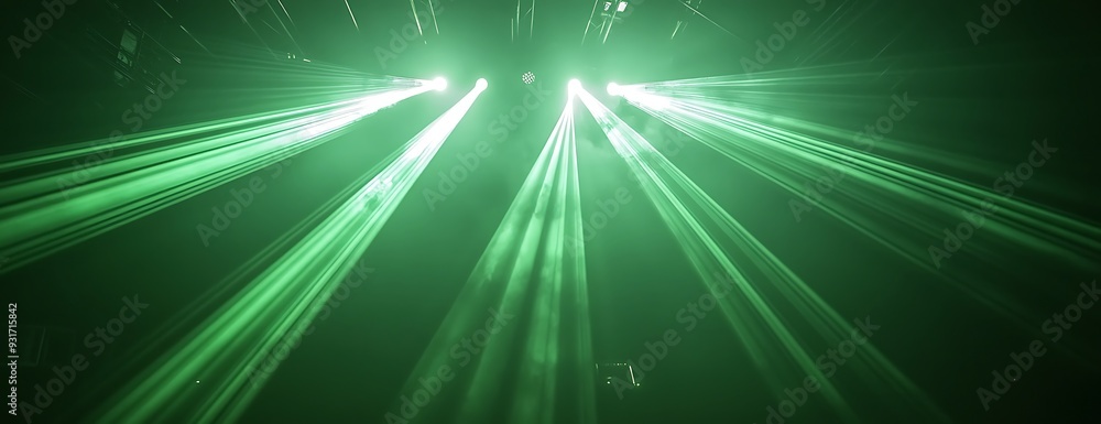 Naklejka premium Abstract green light beams with lens flare effect in dark background.