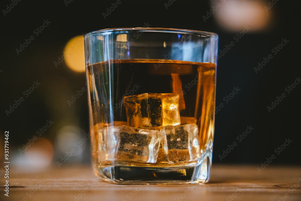 Whiskey drinks at the bar celebrating a special event in a luxury bar. Close-up shows a cheerful atmosphere as glasses clink together, reflecting a lively and joyful gathering. Whiskey drinks at the bar celebrating a special event in a luxury bar. Close-up shows a cheerful atmosphere as glasses clink together, reflecting a lively and joyful gathering.
