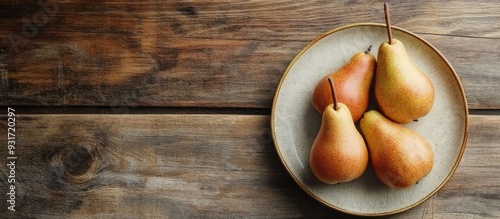 Plate with fresh pears on a...