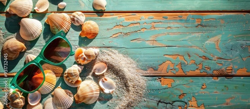 Seashells on a green wooden...