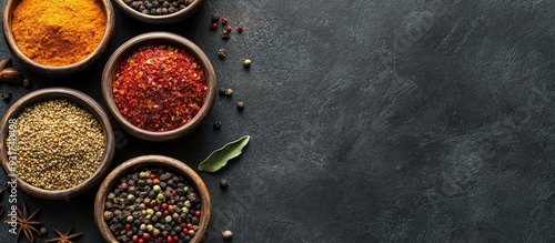 Assorted spices in bowls on...