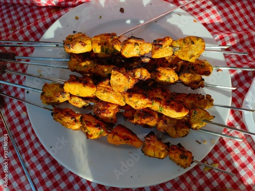 Ben Smim, Morocco - August 08, 2024: Grilling chicken in the lap of the picturesque nature in the middle of the Middle Atlas Mountains, to the sounds of running water photo