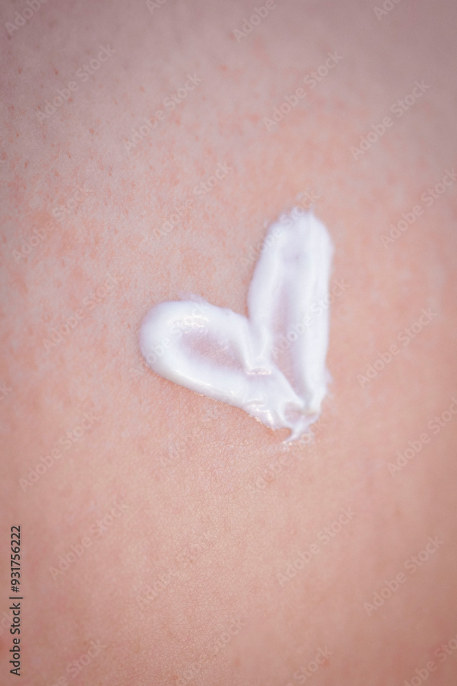 Fototapeta premium texture of cream. SPF cream. Girl applying cream on the beach. moisturizer. close-up. smear