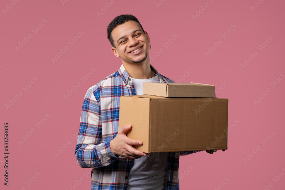 Excited smiling man, online shopping consumer received cardboard order parcel box, desired purchase. Home courier delivery service. Sale, discounts Excited smiling man, online shopping consumer received cardboard order parcel box, desired purchase. Home courier delivery service. Sale, discounts