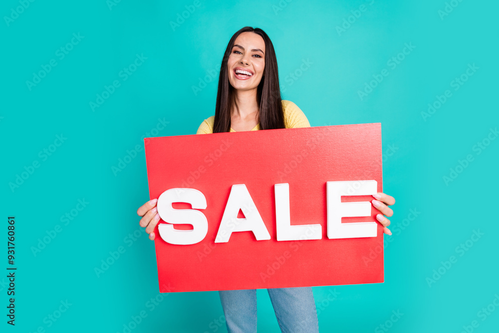 Photo of pretty young woman sale poster wear top isolated on teal color background Photo of pretty young woman sale poster wear top isolated on teal color background