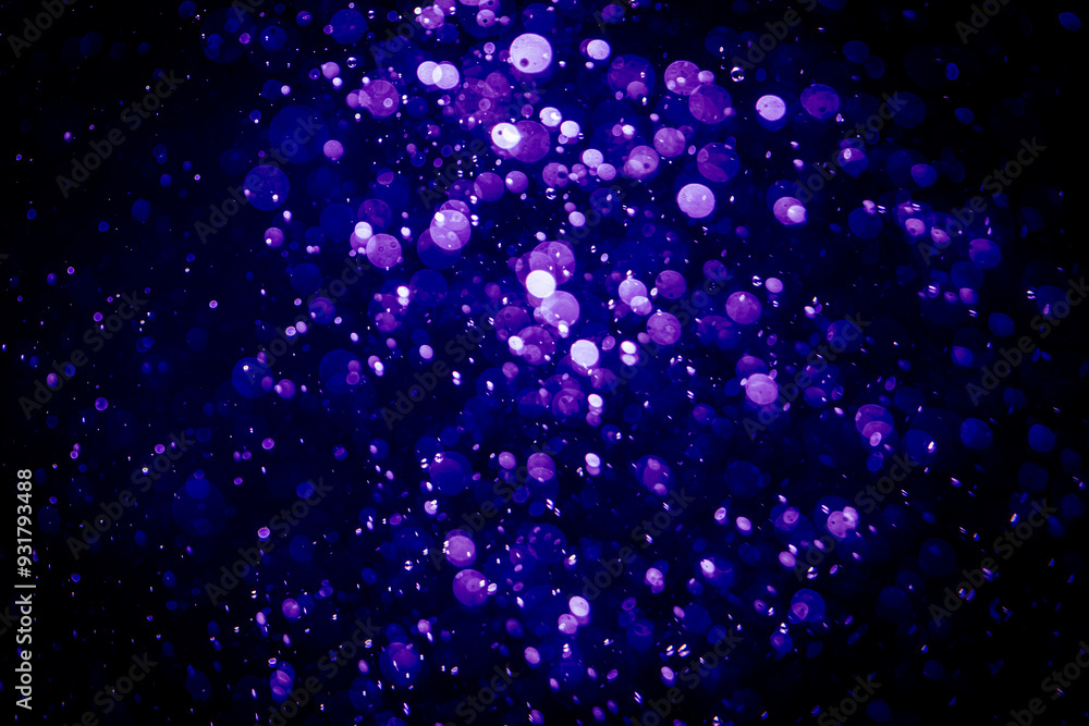 Blurred photo with purple violet and blue dots visible glittering, shining brightly look and feel luxurious Blurred photo with purple violet and blue dots visible glittering, shining brightly look and feel luxurious