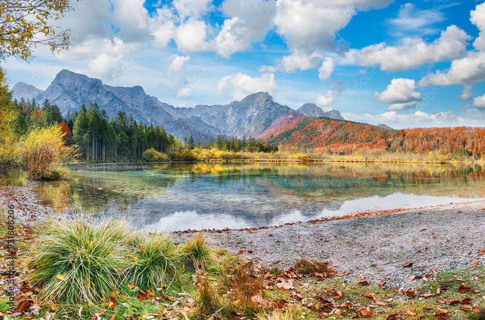 Fabulous autumn scene of sunny morning on Almsee lake.