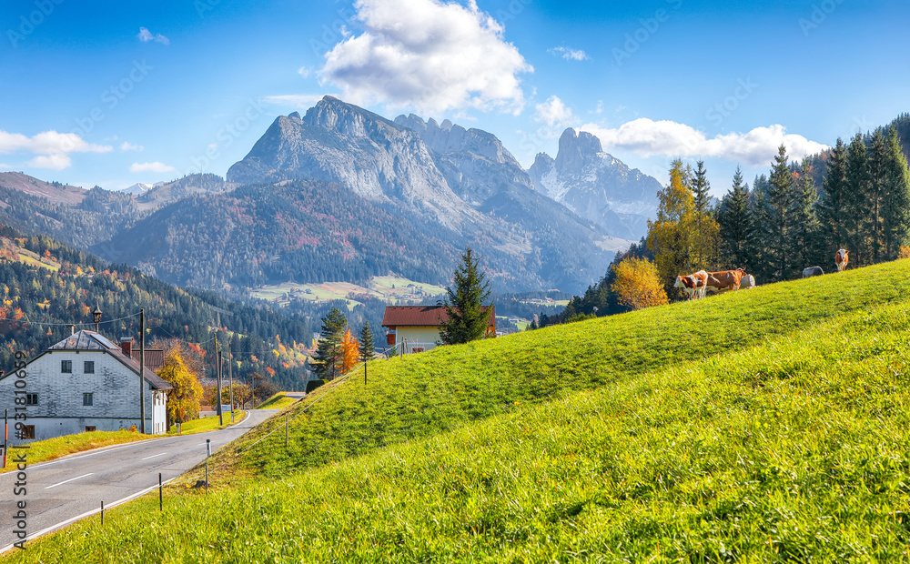 Captivating view of Alpine green fields and traditional wooden houses in Lindenthal village near Abtenau.