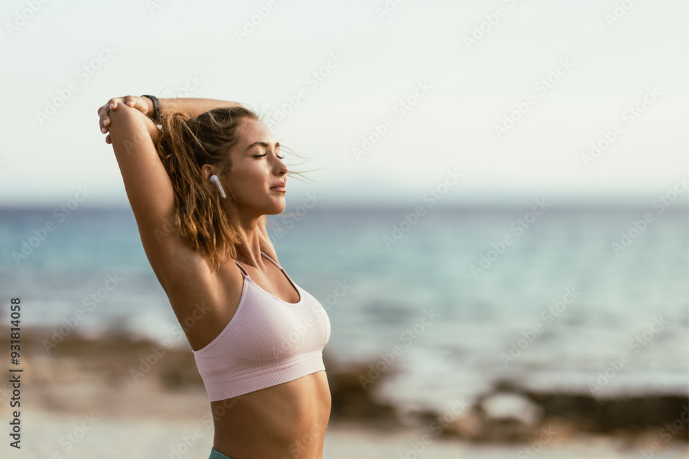 Woman Stretching Before Morning Yoga Routine On The Beach Woman Stretching Before Morning Yoga Routine On The Beach