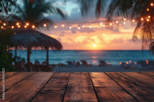 Fototapeta Naklejka Na Ścianę i Meble -  Empty wooden table with blurred beach bar at sunset