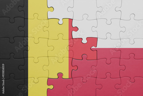 puzzle with the colourful national flag of poland and flag of belgium.