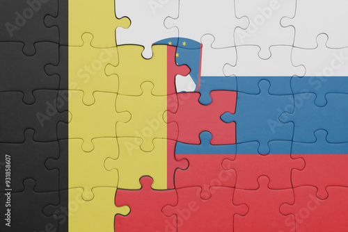 puzzle with the colourful national flag of slovenia and flag of belgium. photo