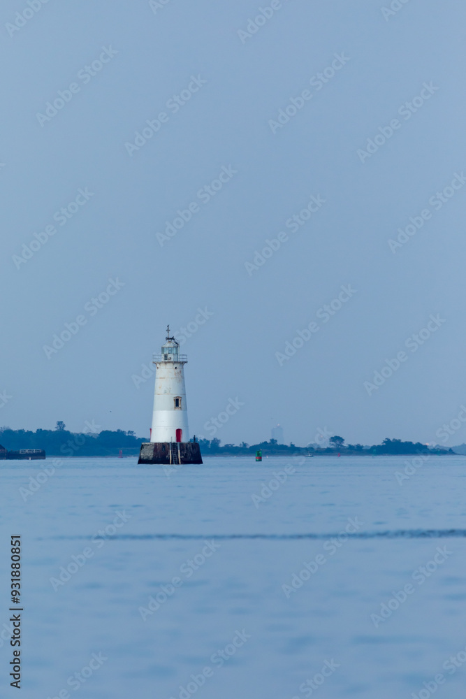 The Great Beds Lighthouse is seen across the Raritan Bay from South Amboy on a beautiful summer evening during golden hour The Great Beds Lighthouse is seen across the Raritan Bay from South Amboy on a beautiful summer evening during golden hour