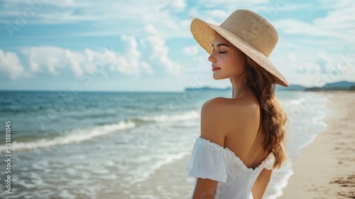 On the beach, unwinding is a stunning young lady wearing a white dress and a straw hat. Savor your weekend or trip.