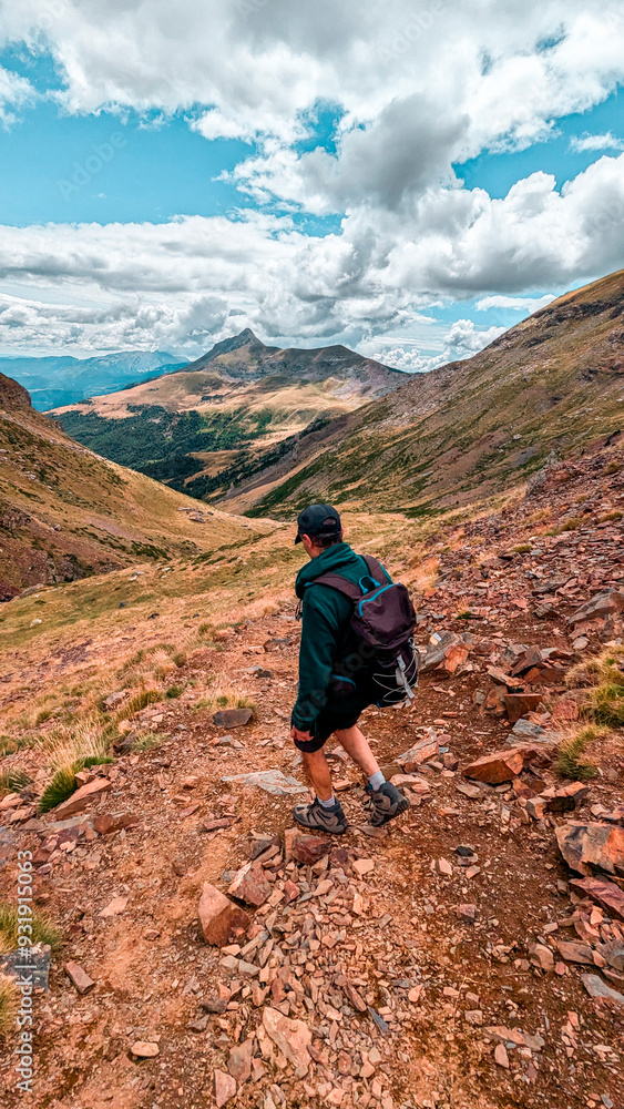 Adventurer in the Pyrenees: Traverse Argualas Peak and Algas Peak, contemplating the majestic landscape of the Ibón de Pondiellos and the Infiernos and Arnales peaks in Panticosa, Tena Valley. Adventurer in the Pyrenees: Traverse Argualas Peak and Algas Peak, contemplating the majestic landscape of the Ibón de Pondiellos and the Infiernos and Arnales peaks in Panticosa, Tena Valley.