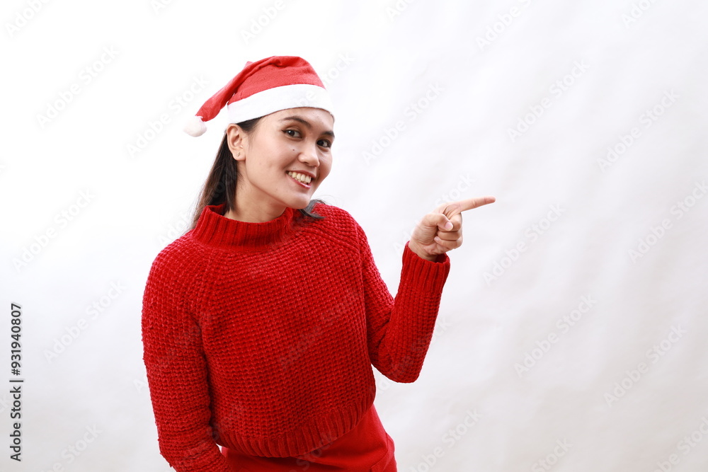 Photo of cute young santa claus helper girl brown hair indicate finger novelty merry christmas brochure isolated on white color background Photo of cute young santa claus helper girl brown hair indicate finger novelty merry christmas brochure isolated on white color background