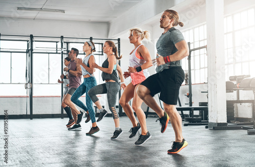 Sports, people and group of athletes in gym for health, wellness and body workout. Team, warm up and personal trainer challenge with active routine for cardio exercise at class in fitness center