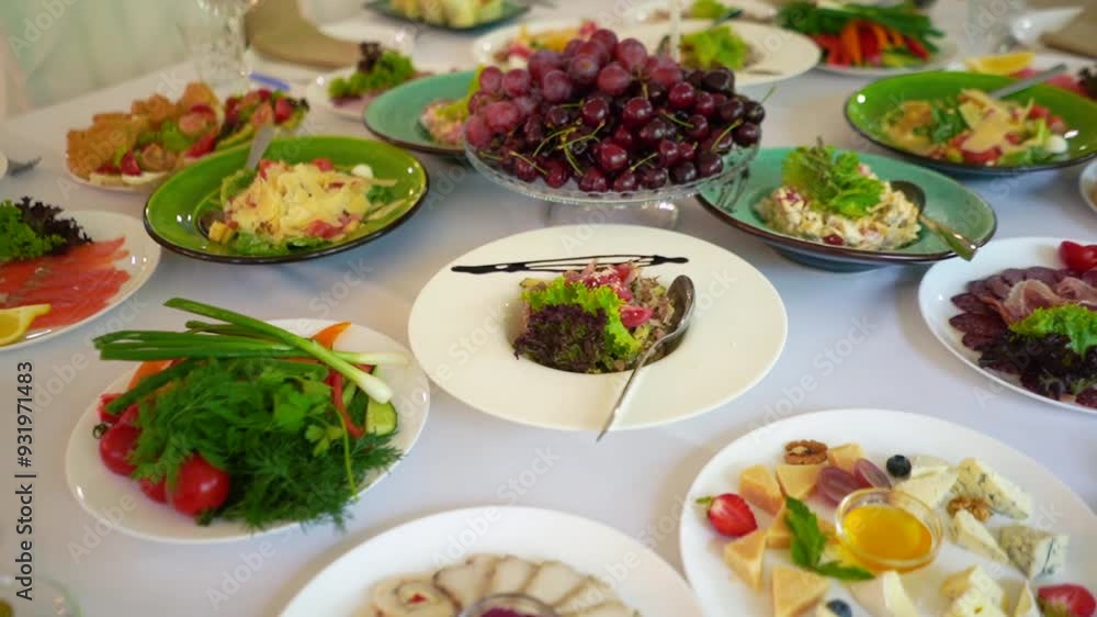 Catering service on banquet table with canape snacks in restaurant or hotel. Decorated food set on birthday, wedding celebration or business conference event venue. Catering service on banquet table with canape snacks in restaurant or hotel. Decorated food set on birthday, wedding celebration or business conference event venue.