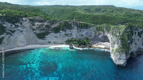 Aerial footage of Atuh Cliff and Diamond Beach on a sunny day in Penida Island, Bali, Indonesia photo