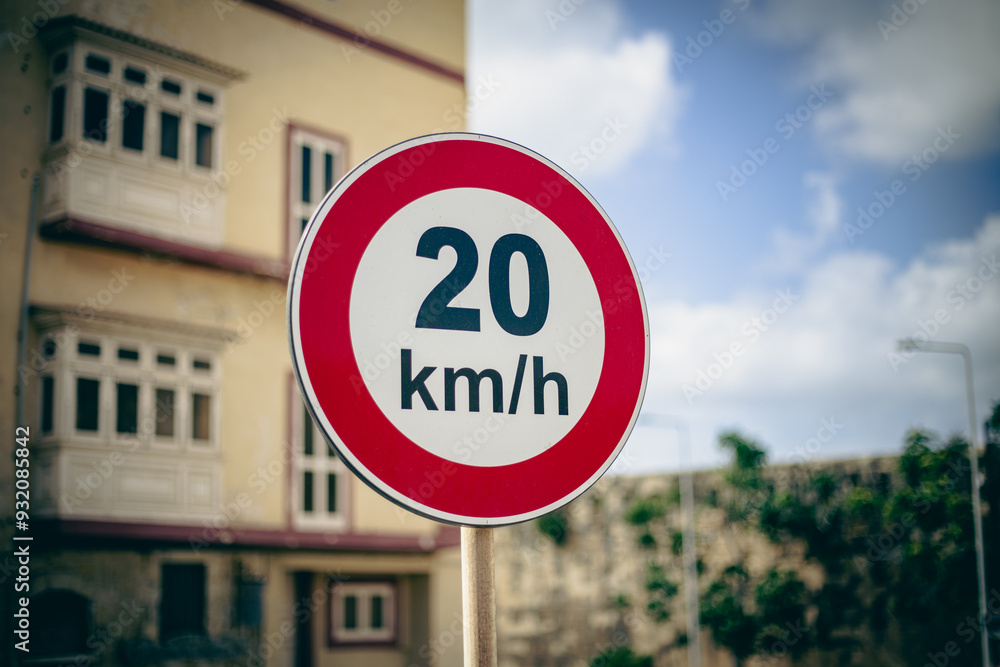 Obraz premium Twenty kilometres speed limit signal in a urban scene 