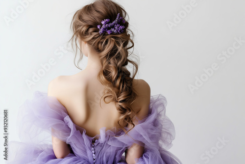 Woman with Loose Braided Hair and Lavender Flowers in Elegant Lavender Gown photo