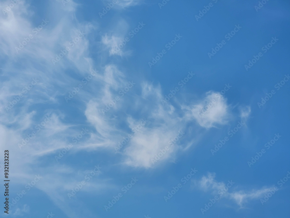 Beautiful blue sky and feathery white clouds nice bright day Beautiful blue sky and feathery white clouds nice bright day