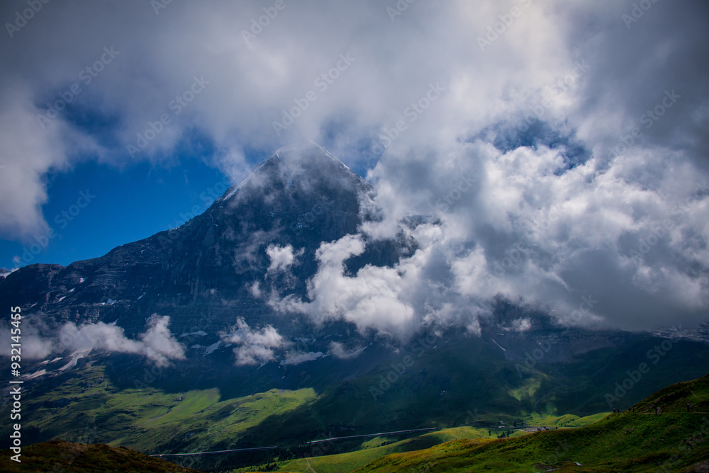 View of Mt Eiger in the Swiss Alps through the clouds, Switzerland View of Mt Eiger in the Swiss Alps through the clouds, Switzerland