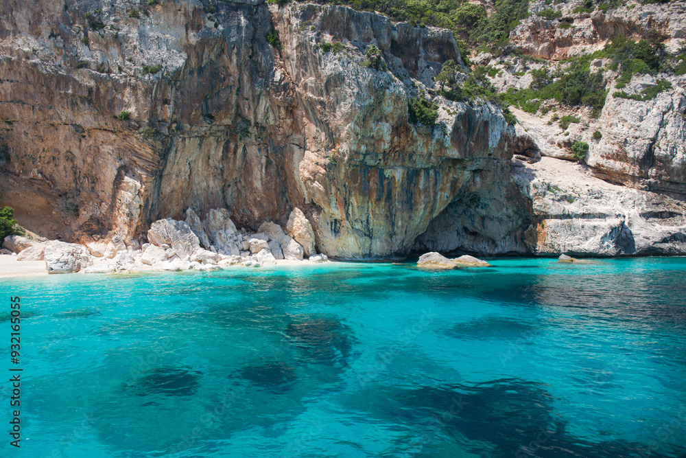 The clear turquoise waters of Cala Mariolu, Gulf of Orosei National Park, Santa Maria Navarrese, Baunei, Nuoro, Sardinia, Italy, Mediterranean The clear turquoise waters of Cala Mariolu, Gulf of Orosei National Park, Santa Maria Navarrese, Baunei, Nuoro, Sardinia, Italy, Mediterranean