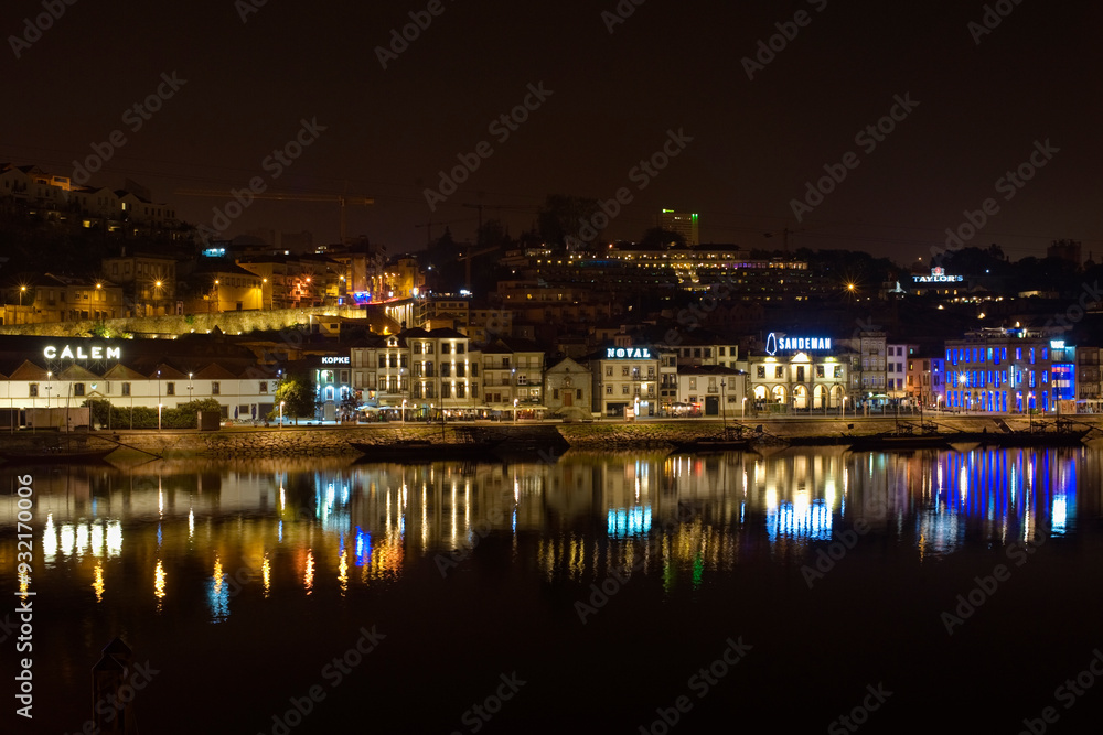 Nightime view across the Duoro River of Porto's south bank, Gaia, housing the cellars of famous Port wine companies, Vila Nova de Gaia, Porto, Norte, Portugal Nightime view across the Duoro River of Porto's south bank, Gaia, housing the cellars of famous Port wine companies, Vila Nova de Gaia, Porto, Norte, Portugal