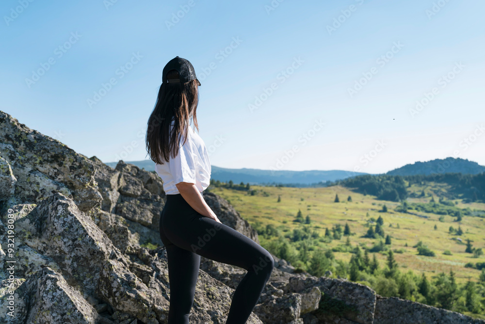 Naklejka premium Traveler Woman standing in the summer mountain .Vitosha Mountain ,Bulgaria 