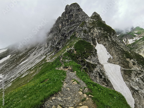 hiking path over the mountain peaks photo