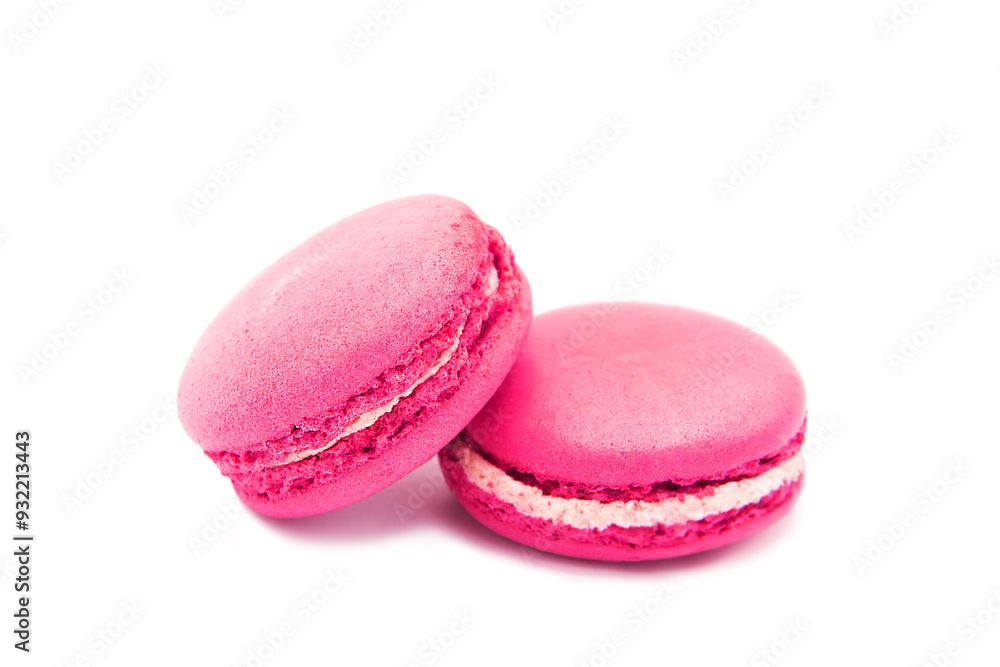 Pink macaron cookies with white filling isolated on a white background. Handmade sweets. Pink macaron cookies with white filling isolated on a white background. Handmade sweets.
