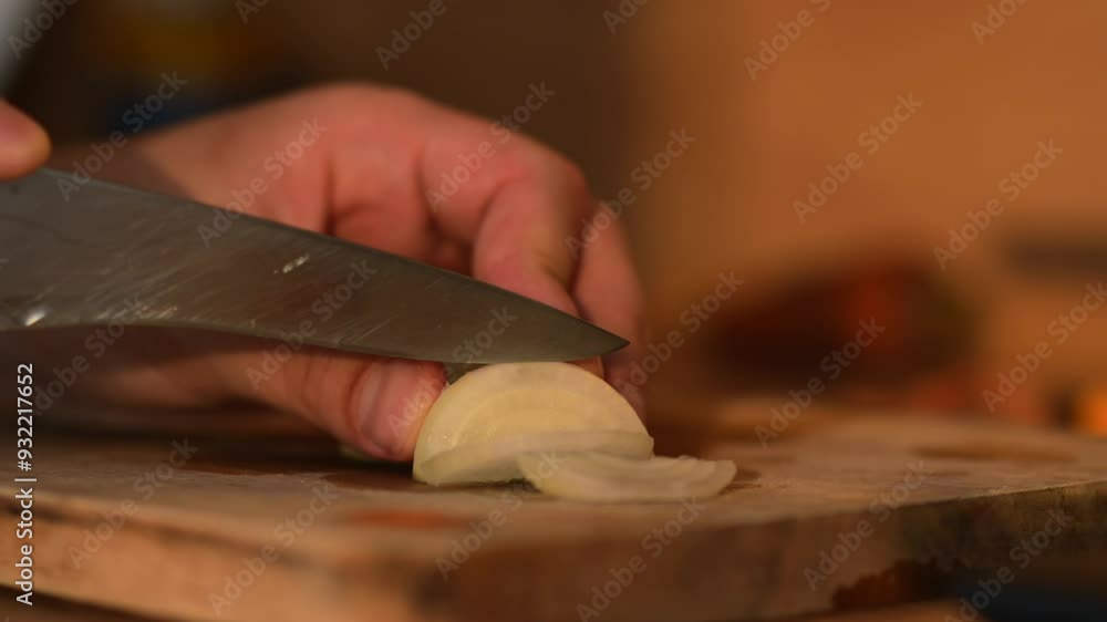 A man cuts an onion with a sharp knife close-up.
Cook in the kitchen chopping onions A man cuts an onion with a sharp knife close-up.
Cook in the kitchen chopping onions