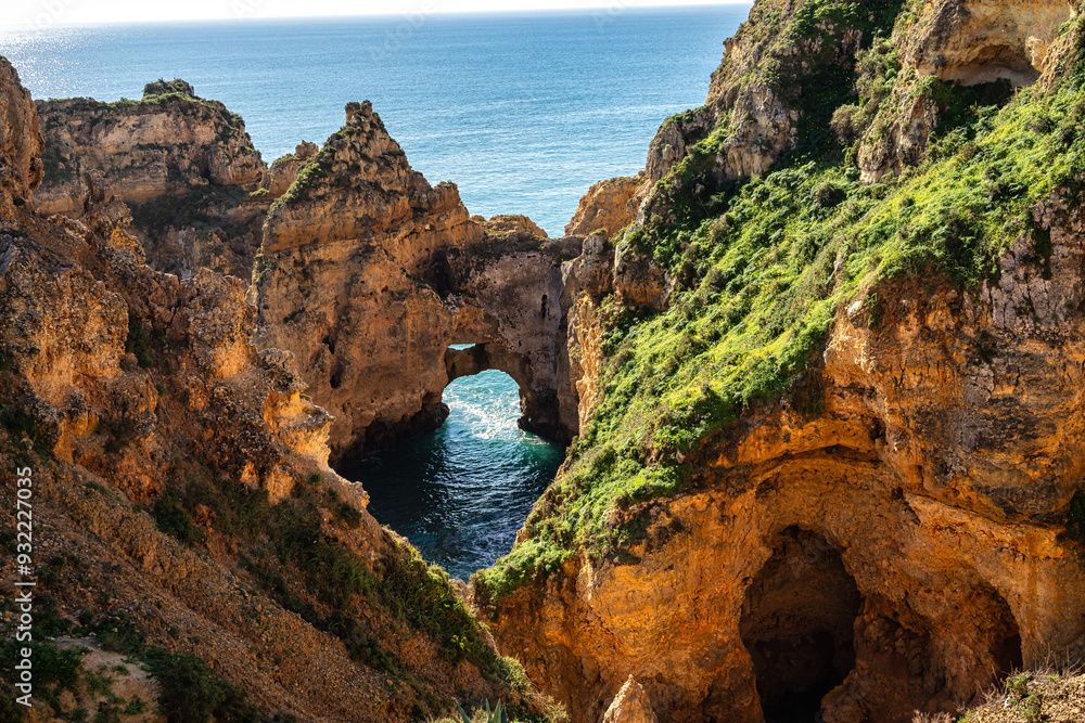 Fototapeta premium Ponta da Piedade is a unique rock formation with famous grottos in the ocean at Lagos, Algrave, Portugal