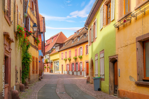 Fototapeta Naklejka Na Ścianę i Meble -  A winding cobblestone street in a residential area of the medieval old town of Ribeauville France, one of the villages of the picturesque Alsace wine region.