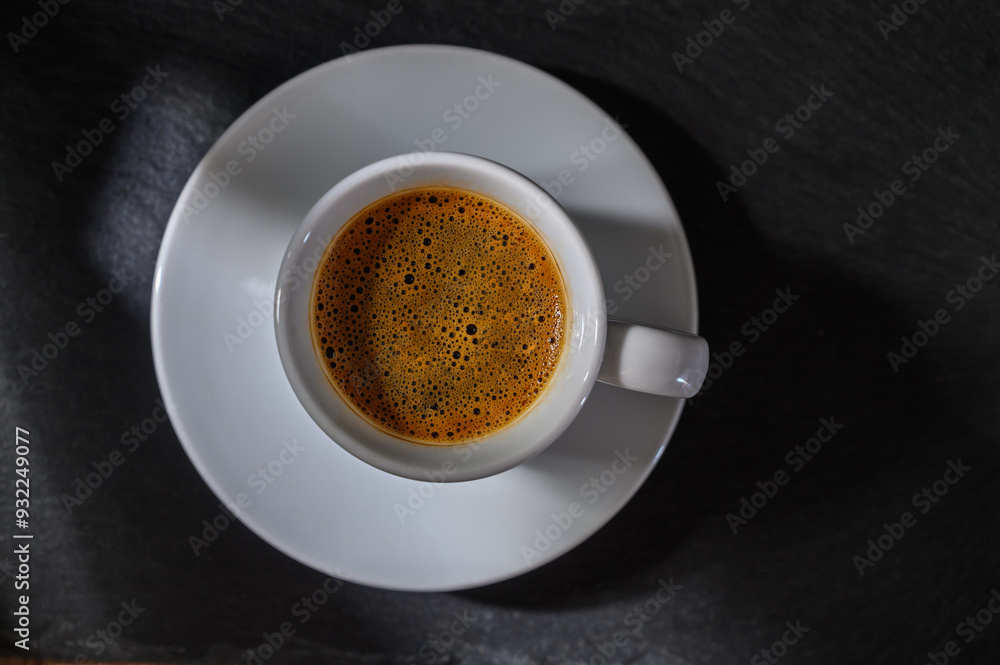 cup of Turkish coffee with foam on a dark background cup of Turkish coffee with foam on a dark background