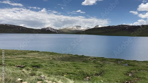 Sheosar Lake in Deosai National Park with clouds and mountains. Shausar Lake in Gilgit Baltistan.  photo