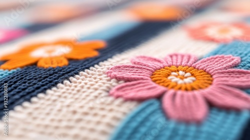 Colorful floral embroidery on fabric with intricate designs and patterns