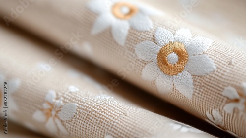 Intricate floral pattern on fabric with gold highlights and soft textures