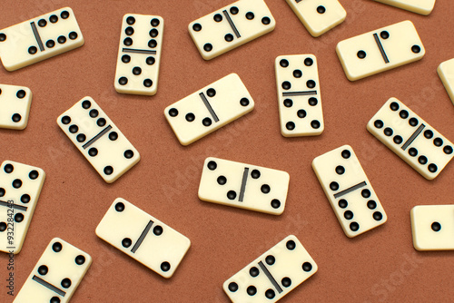 Dominoes bones on brown background 