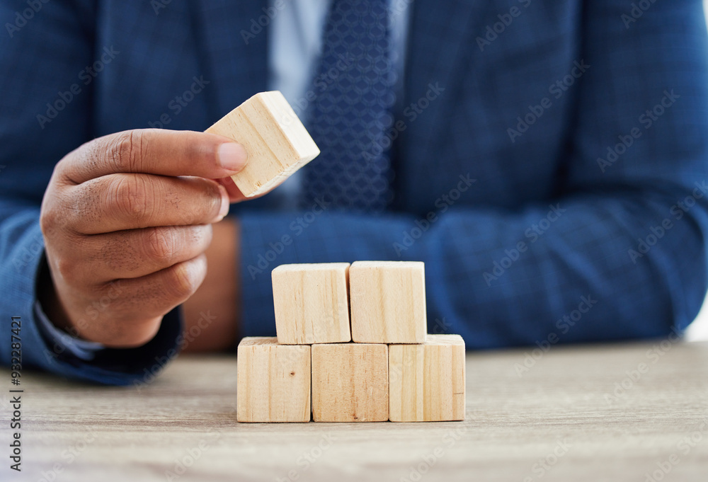 Building blocks, growth and hand with business person at wooden table in office for corporate planning. Balance, finance and investment with employee stacking pieces at desk for career solution Building blocks, growth and hand with business person at wooden table in office for corporate planning. Balance, finance and investment with employee stacking pieces at desk for career solution