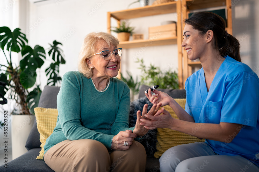 A cheerful caucasian nurse in scrubs provides home health care by checking the blood sugar level of an elderly caucasian woman, ensuring her comfort in a cozy living room setting. A cheerful caucasian nurse in scrubs provides home health care by checking the blood sugar level of an elderly caucasian woman, ensuring her comfort in a cozy living room setting.