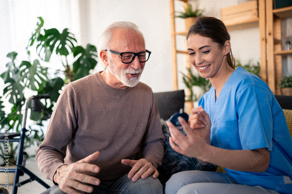 A cheerful Caucasian nurse in blue scrubs attentively measures blood sugar levels of an elderly Caucasian man, providing professional in-home health care. A cheerful Caucasian nurse in blue scrubs attentively measures blood sugar levels of an elderly Caucasian man, providing professional in-home health care.