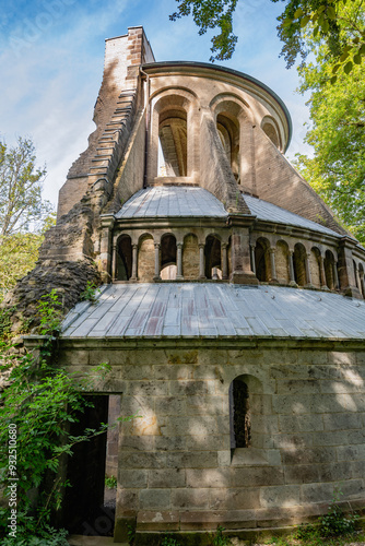 A detailed view of the stonework and arches of the ruins at Klosterruine Heisterbach, showcasing the intricate craftsmanship of the ancient structure. photo