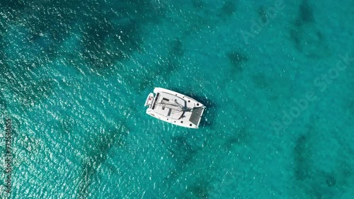 Ascending over catamaran and clear water at Dead Man's Beach, Peter Island, BVI