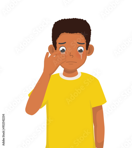 Young African man feeling sad and miserable crying in tears

