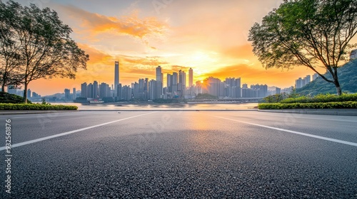 Empty Road Leading to a City Skyline with a Sunset