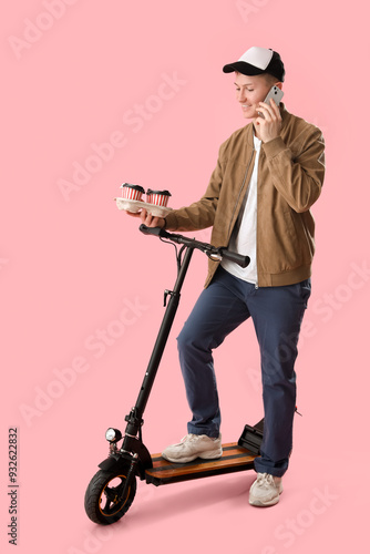 Male courier with coffee an...