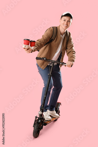 Male courier with coffee ri...