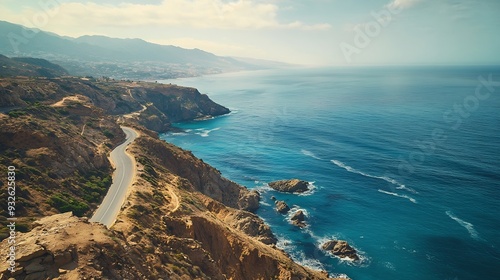 View Atlantic Ocean from mountain in Tangier Morocco  Winding road blue ocean and rocks : Generative AI